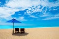 Chairs and umbrellas on a beautiful beach and blue sky Royalty Free Stock Photo