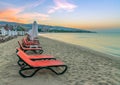 Chairs and umbrellas on a beautiful beach at sunrise in Sunny Beach on the Black Sea coast of Bulgaria Royalty Free Stock Photo