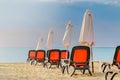 Chairs and umbrellas on a beautiful beach at sunrise in Sunny Beach on the Black Sea coast of Bulgaria Royalty Free Stock Photo