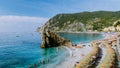 Chairs and umbrellas fill the spiaggia di fegina beach , the wide sandy beach village of Monterosso Italy, part of the