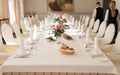 Chairs with white cloth and table for guests served for wedding. Royalty Free Stock Photo