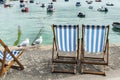 Chaise longues and seagulls Royalty Free Stock Photo