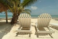 Chaise lounge chairs on a tropical beach. Royalty Free Stock Photo