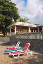 Chaise lounges on Paradise Beach. Kingstown, Saint-Visent