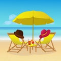 Chaise lounges with umbrella on idyllic tropical sandy beach. Seaside landscape background. Summer holiday vacation