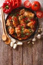 Chakhokhbili chicken stew with vegetables on the table. vertical