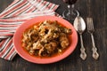 Chakhokhbili - chiken stew with cilantro parsley in tomato sauce in a clay bowl,traditional dish of georgian cuisine Royalty Free Stock Photo