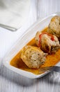 Chakhokhbili, traditional Georgian dish of stewed chicken, tomato and pepper with fresh herbs on wooden background, vertical shot Royalty Free Stock Photo