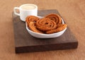 Chakli Indian Savory Snack in a Tray and Coffee