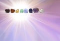 Chakra coloured tumbled healing crystal healing stones template Royalty Free Stock Photo