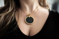 Chakra medallion hanging on the woman`s chest