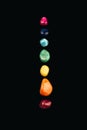 Chakra stones, crystals in a row on black background Royalty Free Stock Photo