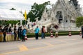 Chalermchai welcome the first group of riders through the white temple. Bike for mom event.