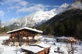 Chalet in French Alps in Chamonix with a panorama of mountains covered in snow in winter Royalty Free Stock Photo