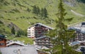 Chalet hotels in swiss village on the hillside in Alps, Switzerland. Royalty Free Stock Photo