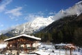 Chalet in French Alps in Chamonix with a panorama of mountains covered in snow in winter Royalty Free Stock Photo