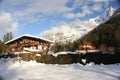 Chalet in French Alps in Chamonix with a panorama of mountains covered in snow in winter Royalty Free Stock Photo