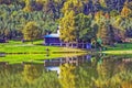 Chalet by lake in Autumn