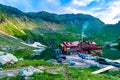 Chalet on shore Balea Lake is glacier lake in the Fagaras Mountains. Transfagarasan road. Beautiful mountains landscape. Royalty Free Stock Photo