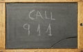 chalk blackboard with call 911 message. flat lay Royalty Free Stock Photo