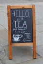 Chalk blackboard sign on the pavement in Nottingham advertising Tea and Cakes