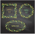 Chalk christmas wreath frames set with cones and fir branches