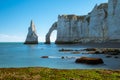 Chalk cliffs of Etretat with the natural arch Porte d`Aval and the stone needle called L`Aiguille