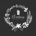 Chalk decorative christmas greeting wreath with house.