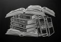 Chalk drawing on a black chalkboard depicting a stack of books Royalty Free Stock Photo