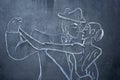 A Chalk drawing of a couple of dancers on the blackboard