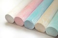 Chalk for drawing multicolored white, pink, blue, yellow, green on a white background Royalty Free Stock Photo