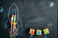 Chalk drawing of a rocket on the background of blackboard. Back to school Royalty Free Stock Photo