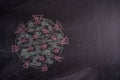 Chalk drawing of a virus COVID-19 on the background of blackboard. Back to school Royalty Free Stock Photo