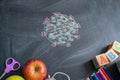 Chalk drawing of a virus COVID-19 on the background of blackboard. Back to school Royalty Free Stock Photo