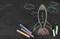 Chalk drawn rocket on blackboard. Back to school concept Royalty Free Stock Photo