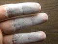 Chalk dust on fingers