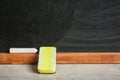 Chalk and duster on table Royalty Free Stock Photo