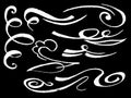 Chalk flourishing swirls ornament on blackboard. Hand-drawn white chalk dividers or border element.