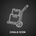 Chalk Hand truck and boxes icon isolated on black background. Dolly symbol. Vector