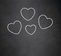 Chalk heart with text Happy Valentines on blackboard blank