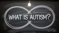 Chalk infinity symbol on blackboard with What Is Autism text under light bulb, educational visual promoting awareness and Royalty Free Stock Photo