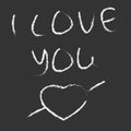 Chalk inscription on the blackboard I love you. A declaration of love and an arrow-pierced heart. White chalk Royalty Free Stock Photo