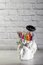 Chalk lettering School. Fashionable concept. David`s head plaster stand for office, creative and school supplies on a light