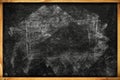 Chalk marks on dirty school blackboard with wooden frame Royalty Free Stock Photo