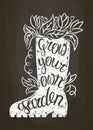 Chalk silhouette of rubber boot with leaves and flowers and lettering - Grow your own gardening on chalk board.