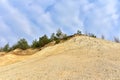 Chalk structure on artificial mountain after quarry mining. Technogenic rock formed during mine. Mountain hill with chalk fossil Royalty Free Stock Photo