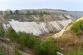 Chalk structure on artificial mountain after quarry mining. Technogenic rock formed during mine. Mountain hill with chalk fossil