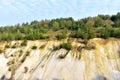 Chalk structure on artificial mountain after quarry mining. Technogenic rock formed during mine. Mountain hill with chalk fossil