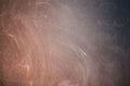 Chalk wiped out on a red-black chalkboard background. Royalty Free Stock Photo