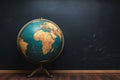 Chalkboard atlas World globe displayed on a vintage chalkboard surface